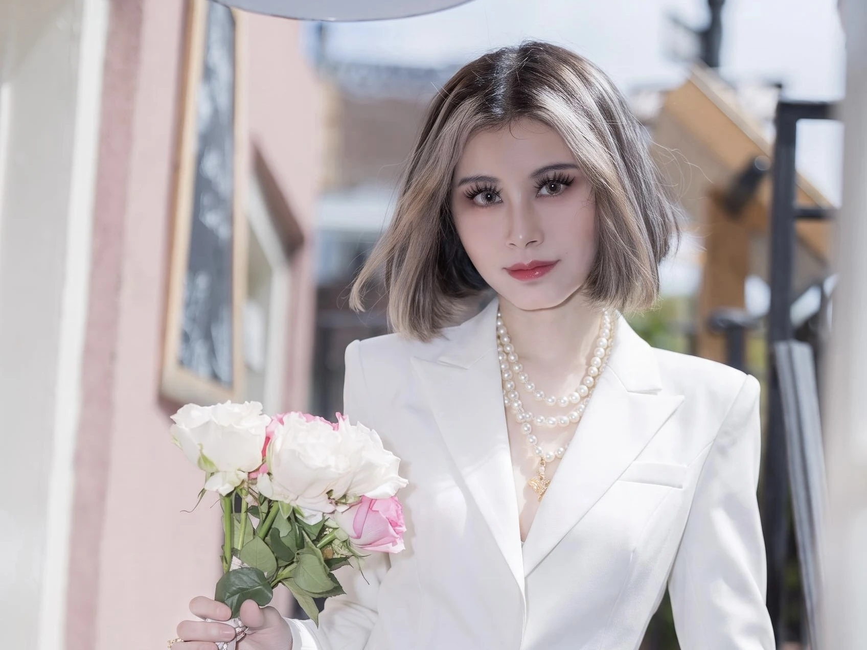 Amelia Hu in a white blazer